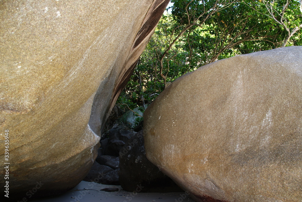 giant boulders on the sea beach against the background of the turquoise sea giant boulders on the sea beach against the background of the turquoise sea