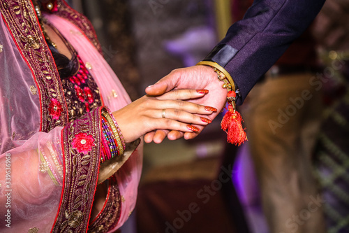 Close up of Indian couple's hands at a wedding © Abshine Photography