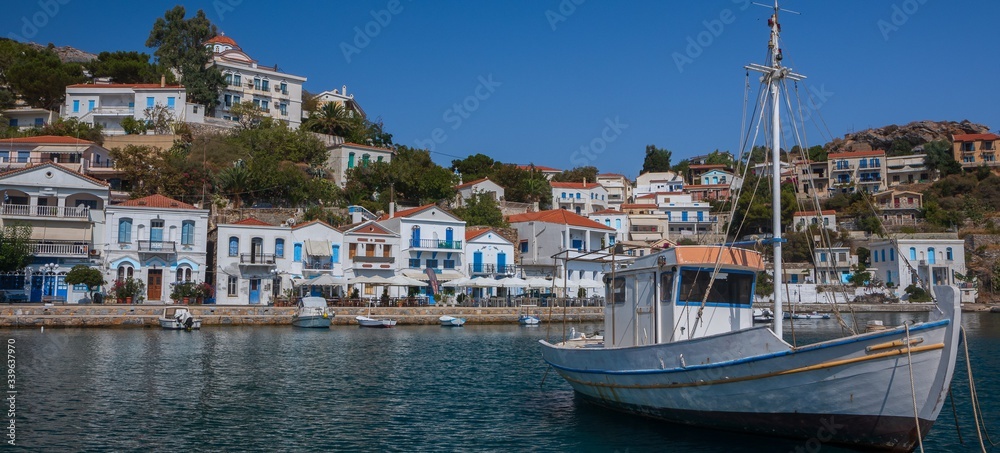 panoramic view to the beautiful port of Evdilos on the Greek Island Ikaria, banner, panorama