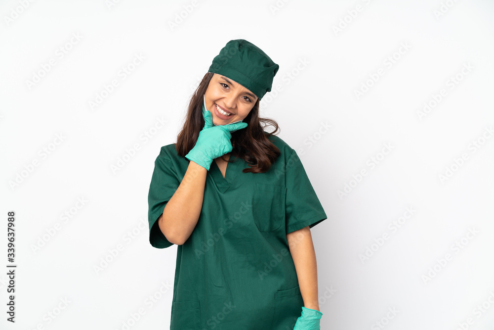 Surgeon woman in green uniform isolated on white background smiling Surgeon woman in green uniform isolated on white background smiling
