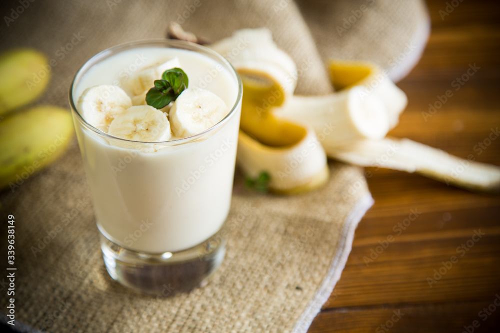tasty homemade yogurt with bananas in a glass on a wooden table tasty homemade yogurt with bananas in a glass on a wooden table