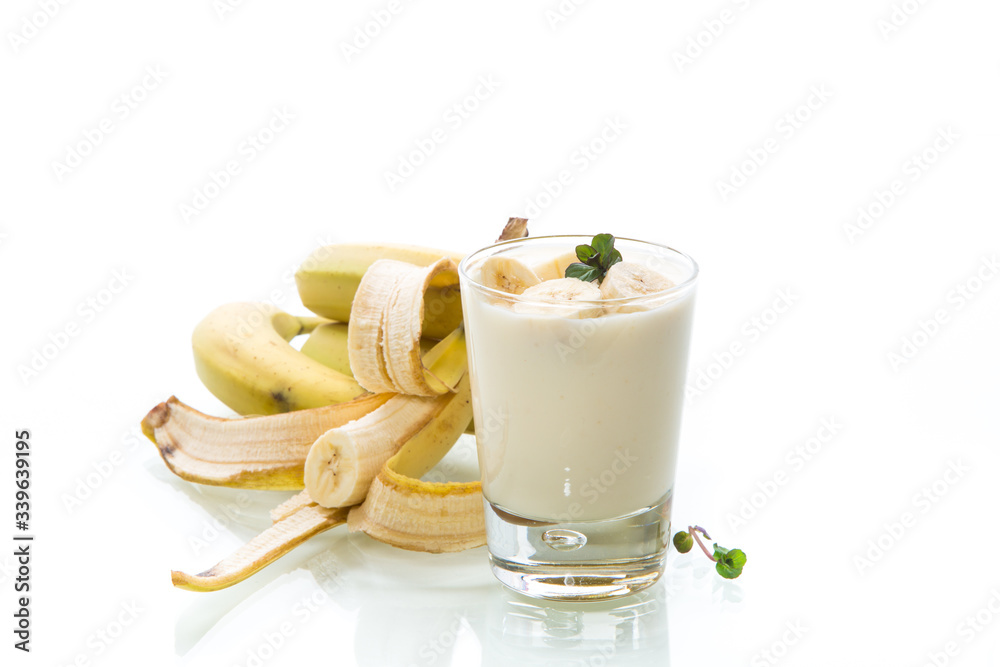 tasty homemade yogurt with bananas in a glass isolated on white background tasty homemade yogurt with bananas in a glass isolated on white background