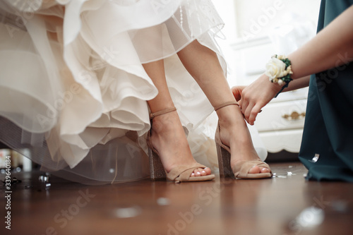 button up the sandals to the bride