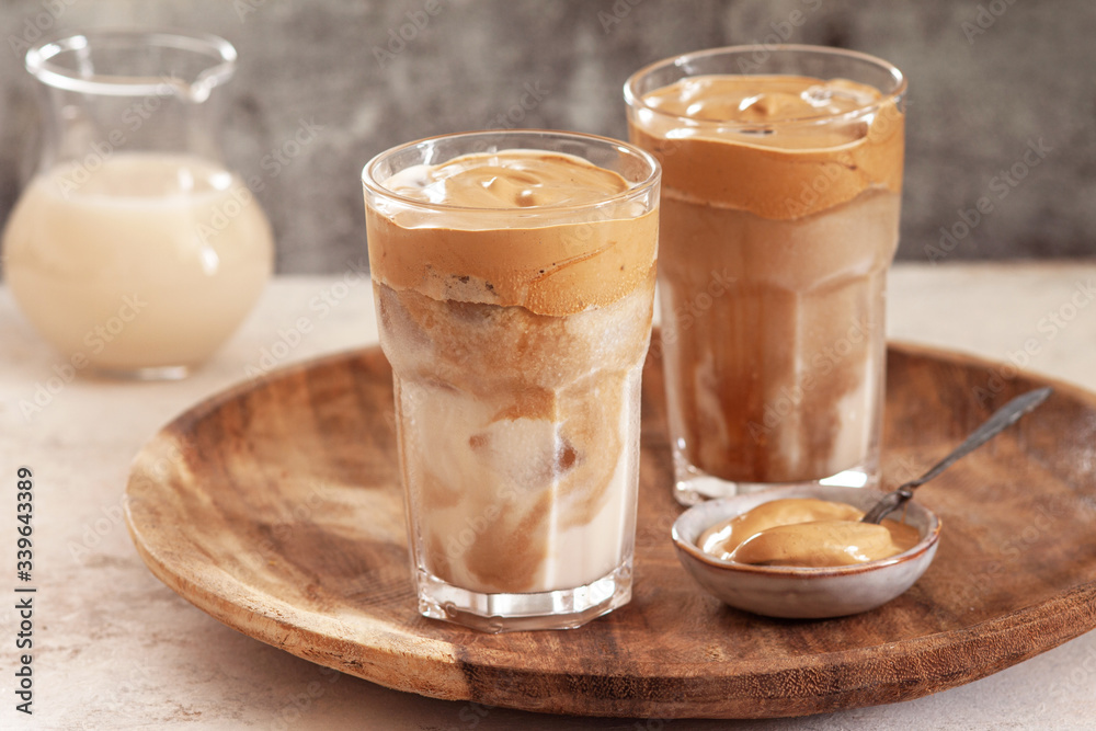 Iced Dalgona Coffee, a trendy fluffy creamy whipped coffee Iced Dalgona Coffee, a trendy fluffy creamy whipped coffee