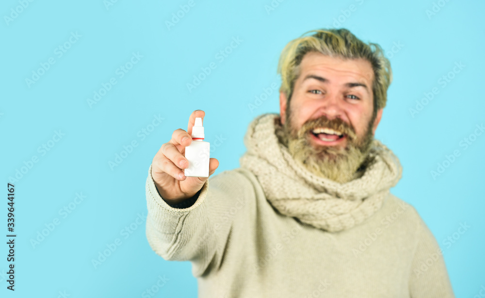 pandemic concept. man treat runny nose with nasal spray. free your stuffy nose. no addiction to medicals. coronavirus from china. happy hipster presenting best remedy. Nasal drops plastic bottle pandemic concept. man treat runny nose with nasal spray. free your stuffy nose. no addiction to medicals. coronavirus from china. happy hipster presenting best remedy. Nasal drops plastic bottle