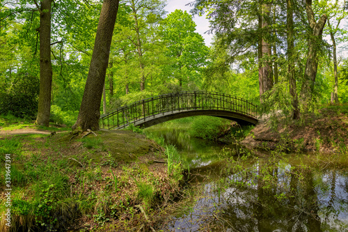 Bridge over river in the green park, Poland © Jiri Dolezal