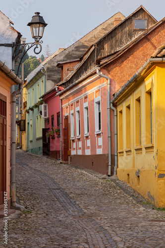 Medieval street with colourful houses in Sighisoara, Romania.