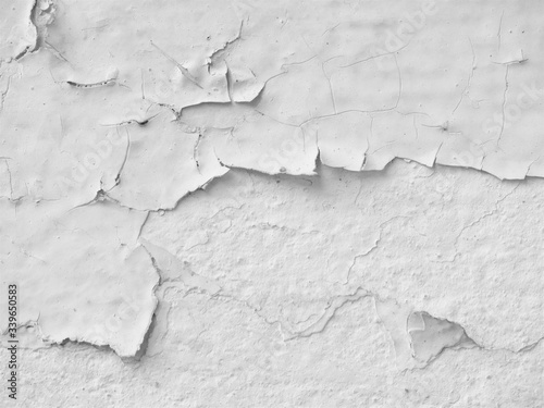 White old painted wall peeling off. Cause by low quality paint that has inadequate adhesion and flexibility,Over thinning the paint or spreading it too thin. Poor adhesion of the underlying coats.