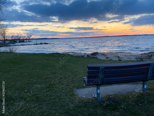 bench on the beach lake sunset