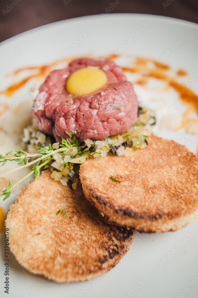 veal tartare with chicken yolk and toast