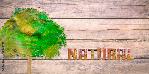 Fotografie Ilustración con un árbol y el título natural con un fondo de madera