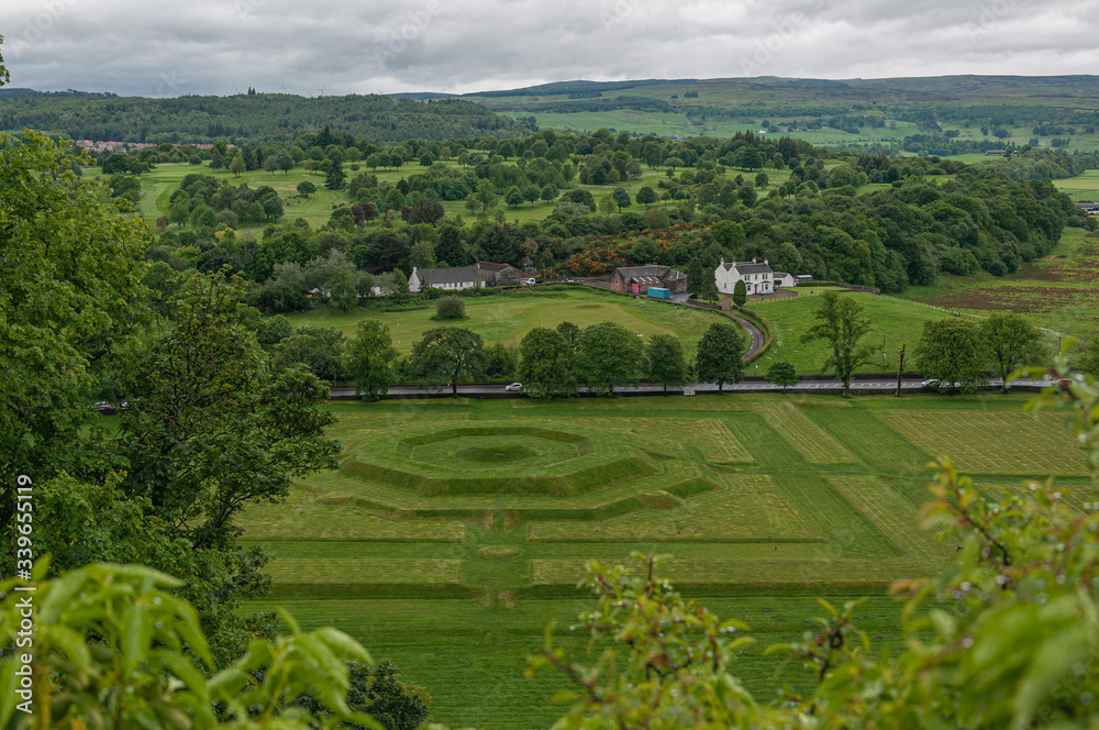 View of the Scottish countryside with creatively landscaped green meadows, Stirling, UK