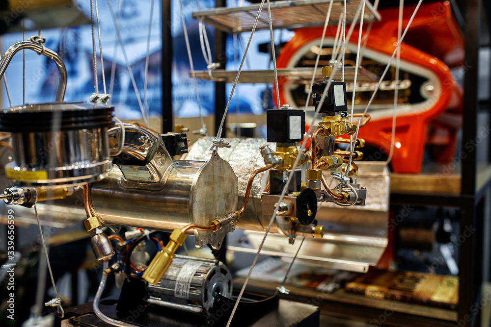 The model of the internal units of the coffee machine. The stand of the disassembled coffee machine The model of the internal units of the coffee machine. The stand of the disassembled coffee machine