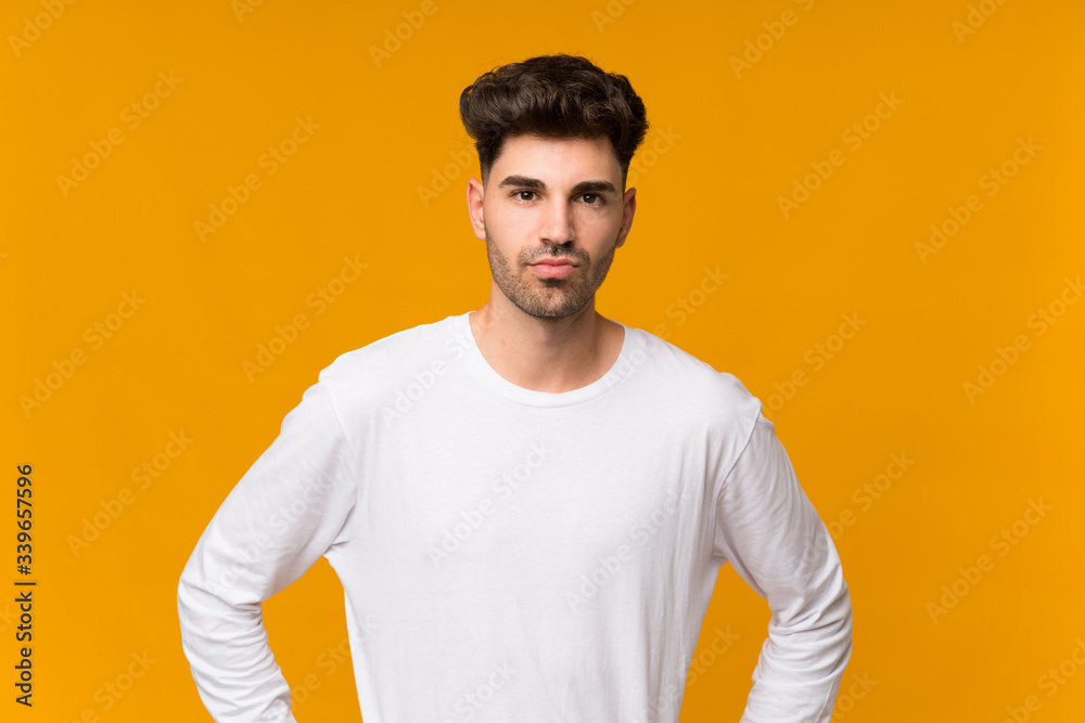 Young man over isolated orange background angry Young man over isolated orange background angry