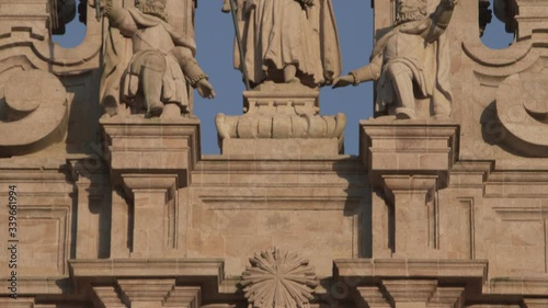 Statue of the Apostle Santiago on facade of Santiago de Compostela cathedral at sunset. Galicia, Spain