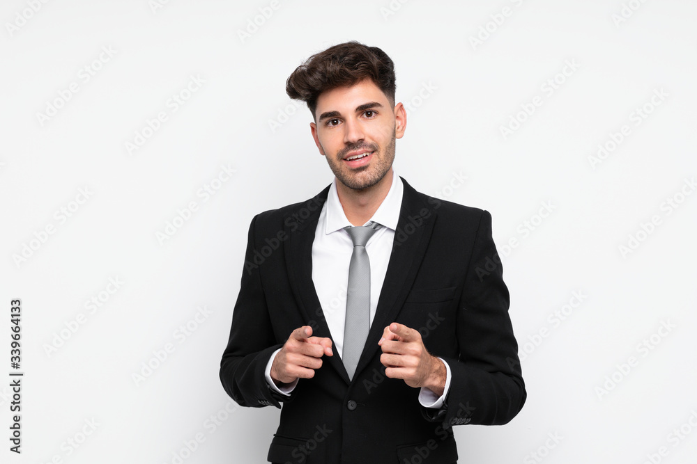 Young businessman over isolated white background points finger at you Young businessman over isolated white background points finger at you