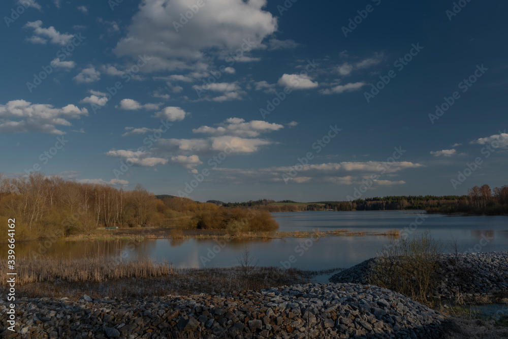 End of Lipno dam with dry grass in dry spring sunny day