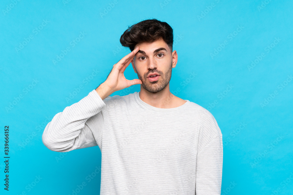 Young man over isolated blue background has just realized something and has intending the solution Young man over isolated blue background has just realized something and has intending the solution