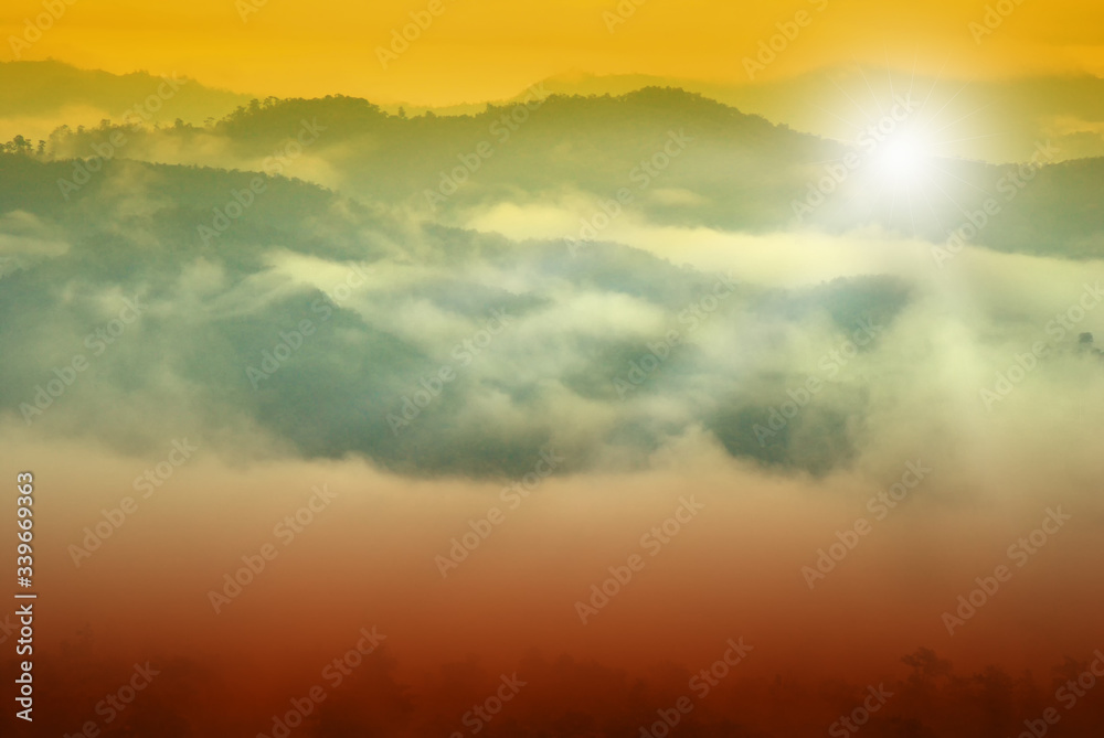 Sunrise among forests and mountains