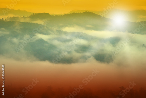 Sunrise among forests and mountains