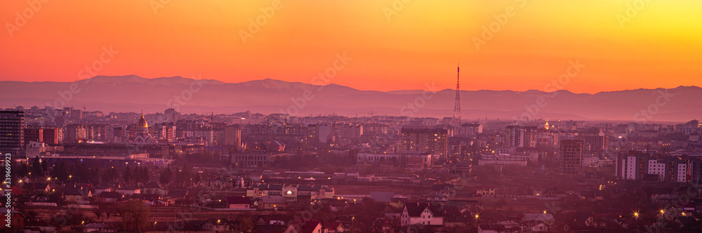 Sunset on the background of the city in spring
