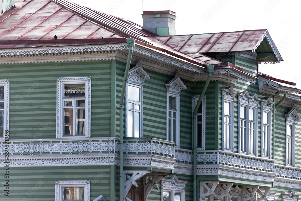 A large wooden house. Old wooden architecture. The center of a small town.