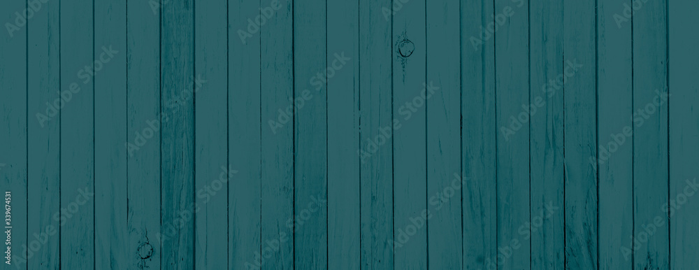 Faded blue gray reclaimed wood surface with aged boards. Wooden planks with grain and texture. Faded blue gray reclaimed wood surface with aged boards. Wooden planks with grain and texture.