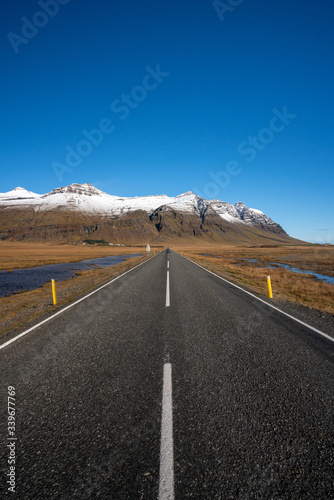 Mountain Landscape in Iceland during clear blue sky weather with snow on the mountains