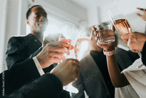 Vászonkép Team celebrating with champagne