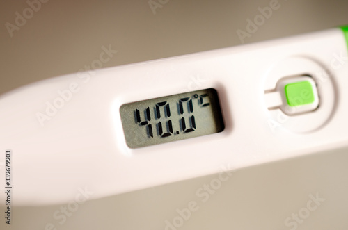 Isolated thermometer showing 40 degrees Celsius. High Temperature. Fever. 