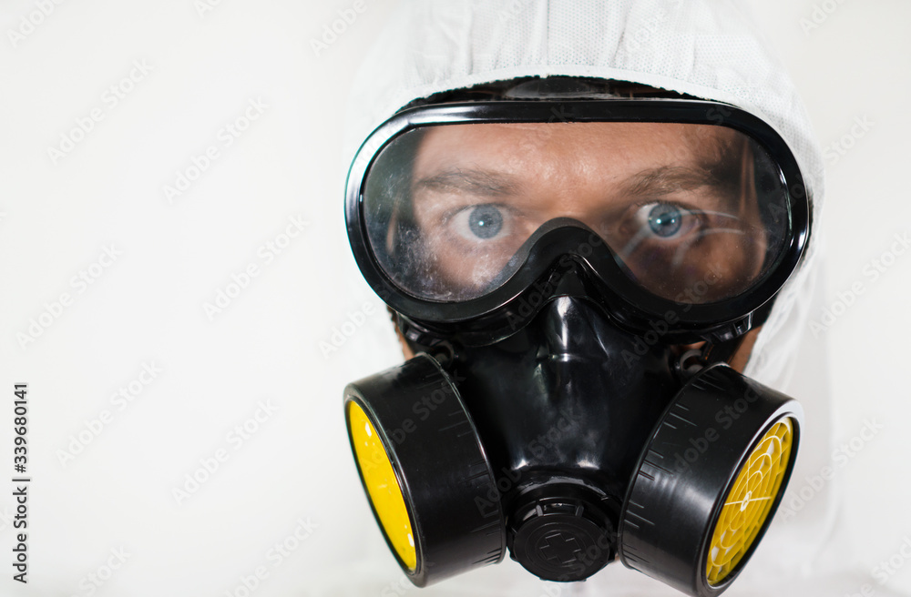Male doctor in protective suit and mask. Place for text Male doctor in protective suit and mask. Place for text
