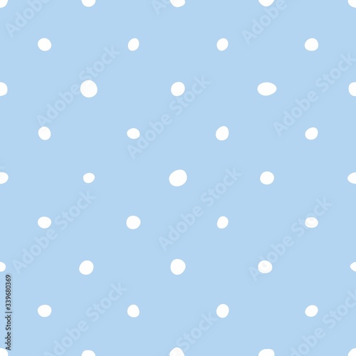 Tile vector pattern with white polka dots on pastel blue background
