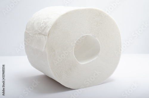 Isolated roll of toilet paper on a white background.