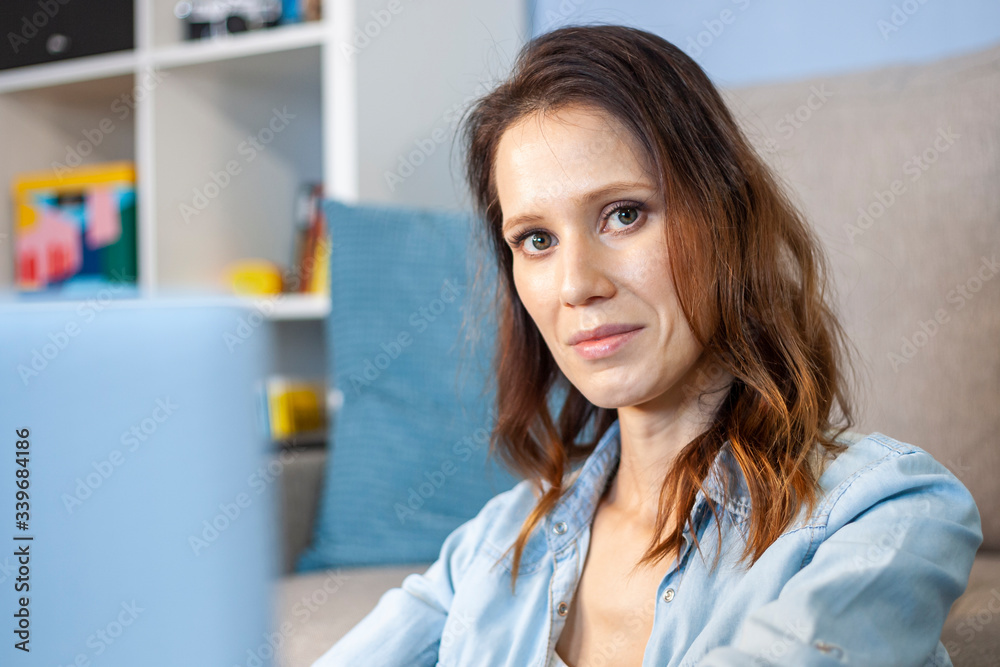 Beautiful young woman working from home. Work in home office Beautiful young woman working from home. Work in home office