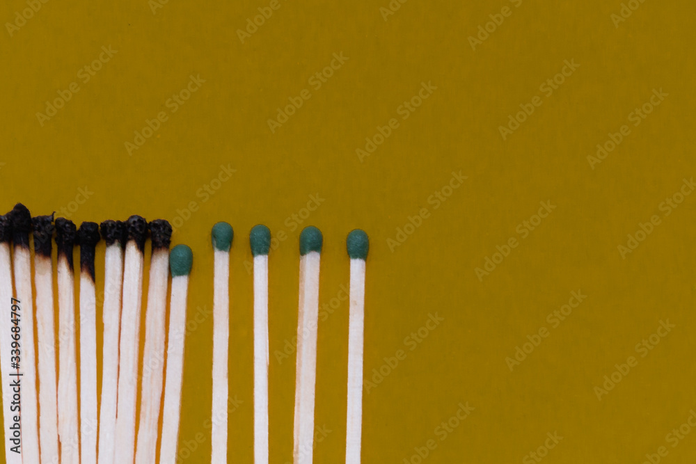 Matches are burning. One match prevents the spread of fire - the concept of how to stop the spread of coronavirus - keep your distance to avoid infection, stay at home. Matches are burning. One match prevents the spread of fire - the concept of how to stop the spread of coronavirus - keep your distance to avoid infection, stay at home.