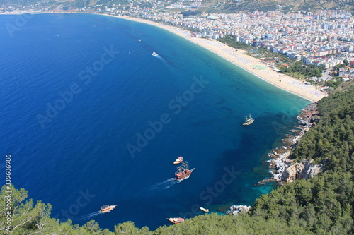 mid-sea, Turkey, Alanya. Sea and mountains landscape in sunny summer day. Alanya beach panoramic view.