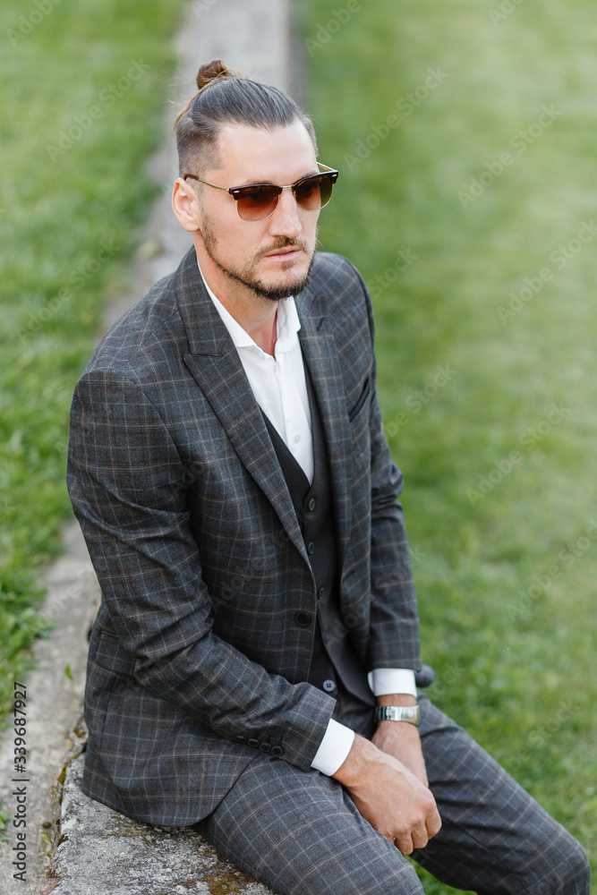 portrait of a fashionable guy in a suit portrait of a fashionable guy in a suit