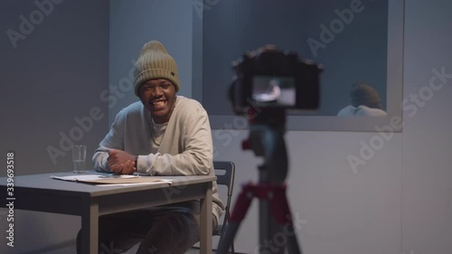 The criminal laughs in front of the camera