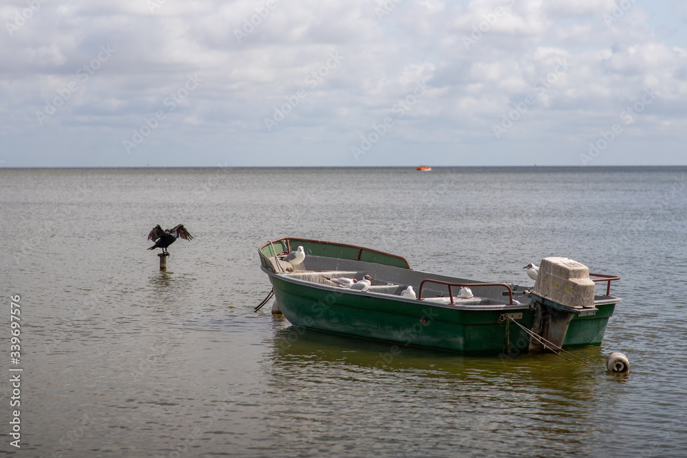 Naklejka premium fishing boats on the beach