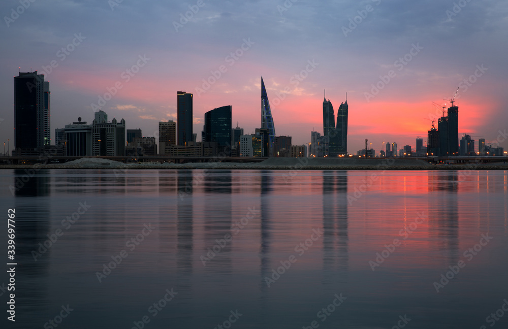 Beautiful sky and reflection of Bahrain skyline at sunset
