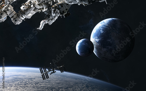 Fototapeta Naklejka Na Ścianę i Meble -  Astronaut, space stations on background of planets somewhere in deep space. Science fiction. Elements of this image furnished by NASA