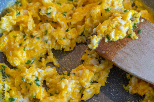 Scrambled egg in a frying pan.
