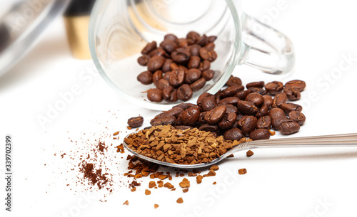 Macro shot of instant granules and beans coffee on a white