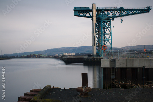 A Crane near the river Clyde near Glasgow in the west of Scotland on a cold winter morning.  © gavin