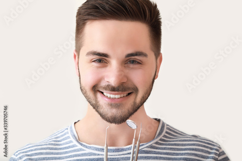 Happy smiling young man wit...