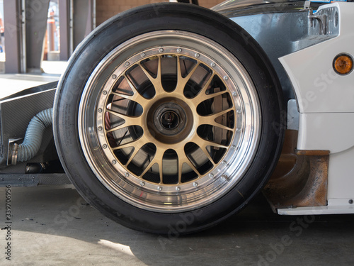 Fotografija Close Up View of Race Car Wheel and Tire