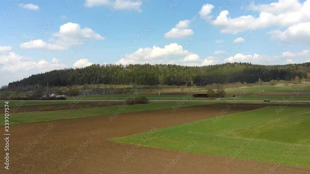 plowed and sown field, green grass partially sowed, plowed and sown field, green grass partially sowed,