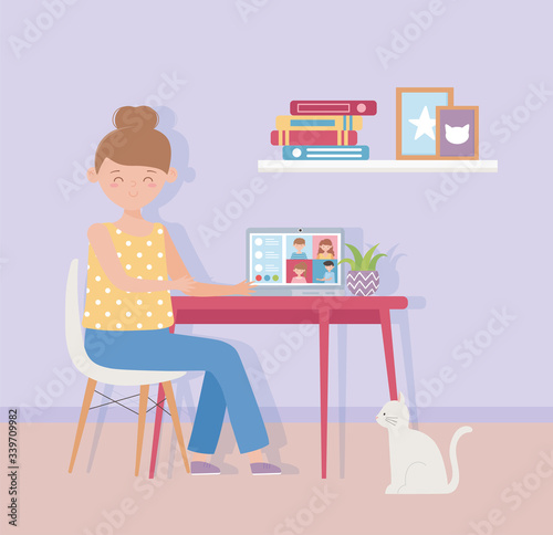 meeting online  woman working laptop in desk with cat in home