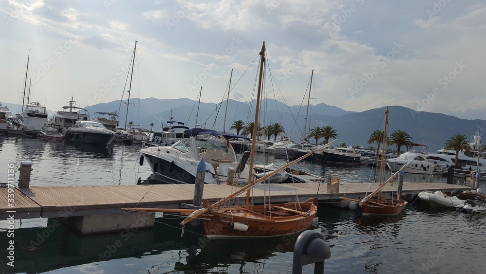 Fototapeta premium boat, sea, water, harbor, marina, yacht, boats, ship, sky, port, ocean, sailboat, harbour, sailing, blue, dock, yachts, sail, summer, travel, lake, bay, fishing, barcelona, vessel, Paradise, heaven, 