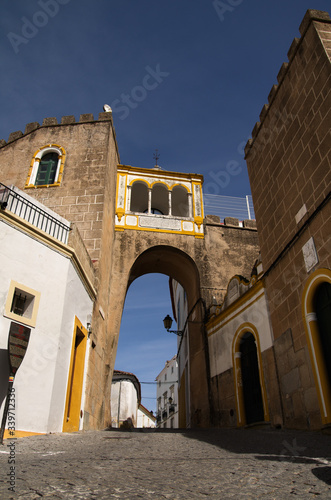 Santa Clara archway over a cobblestone street at Elvas, Portugal